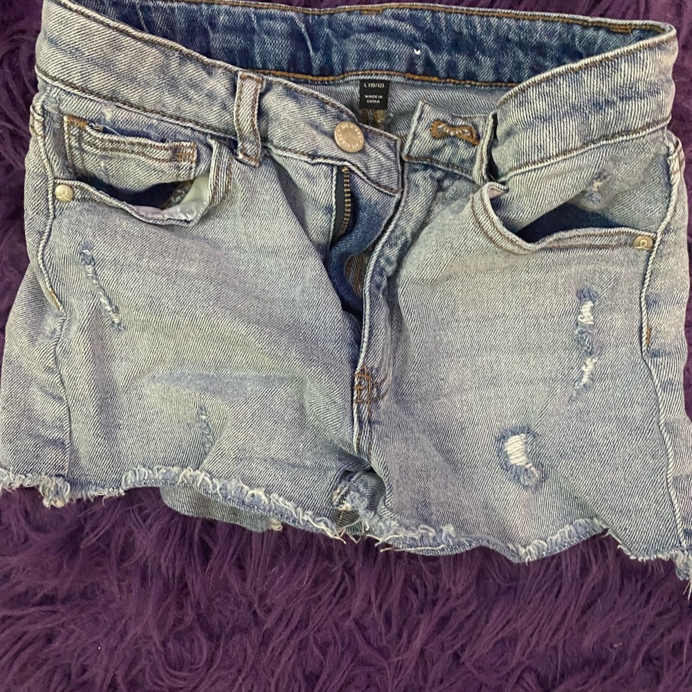 Ripped light jean shorts.